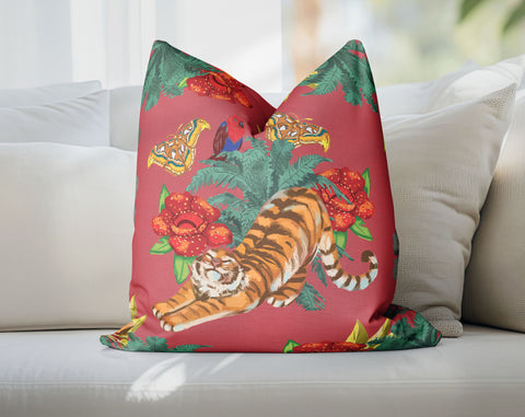 a red pillow with a tiger on it