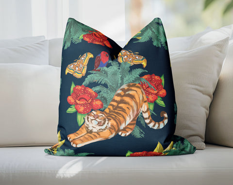 a pillow with a tiger on it on a couch