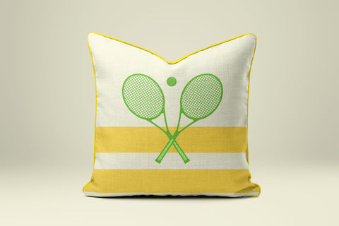A yellow and white throw pillow with a graphic of two crossed tennis rackets on it.