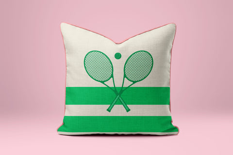 A white and green striped pillow with a graphic of two crossed tennis rackets.