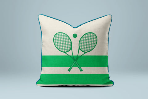 A green and white striped pillow with a tennis racket design on it.