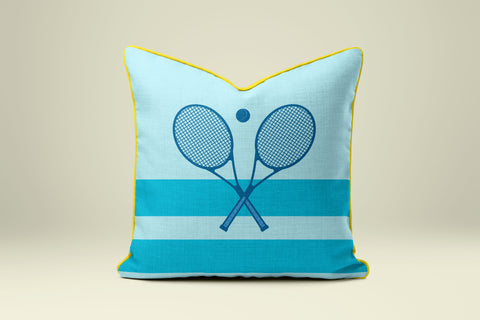 A blue and yellow throw pillow with a tennis racket design on it.